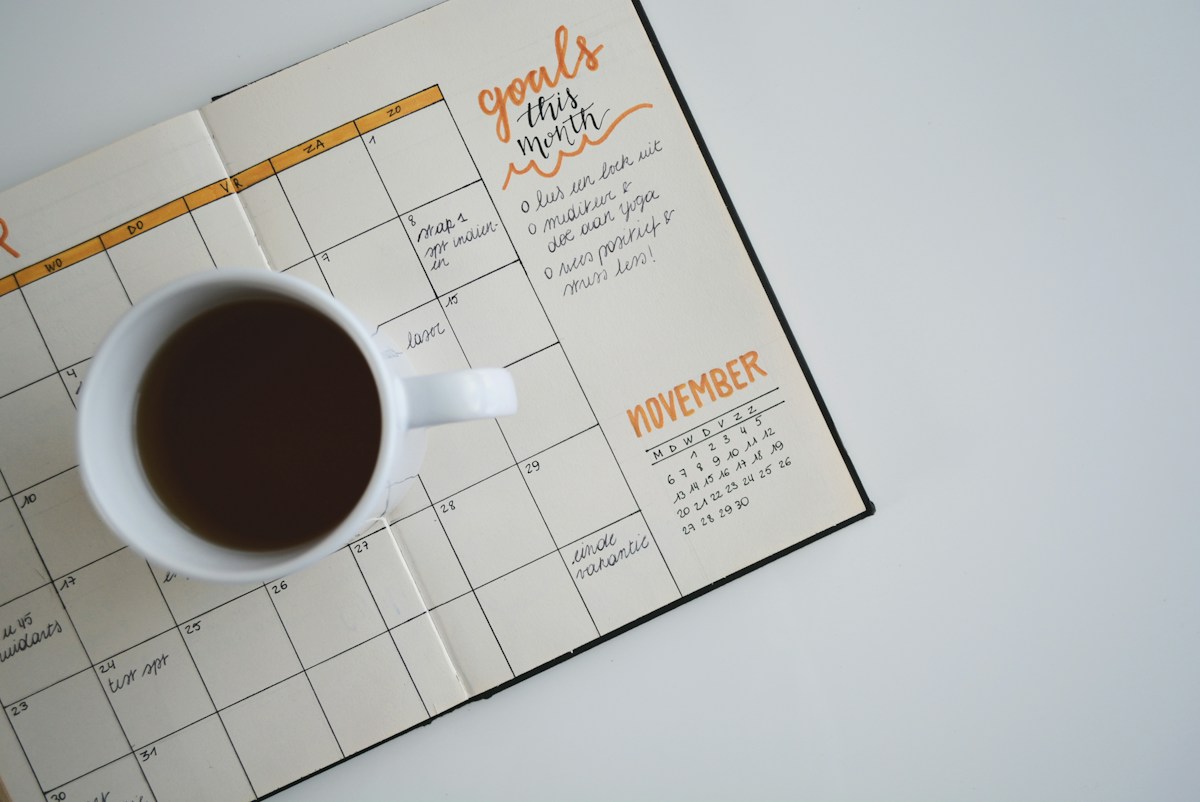 Planning tools and a notebook used to organize milestones and digital change priorities