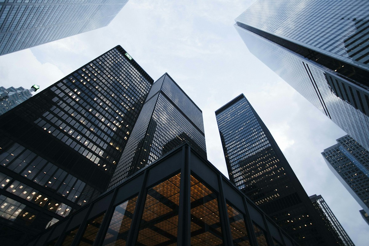 Upward view of modern architecture expressing resilient systems and future growth